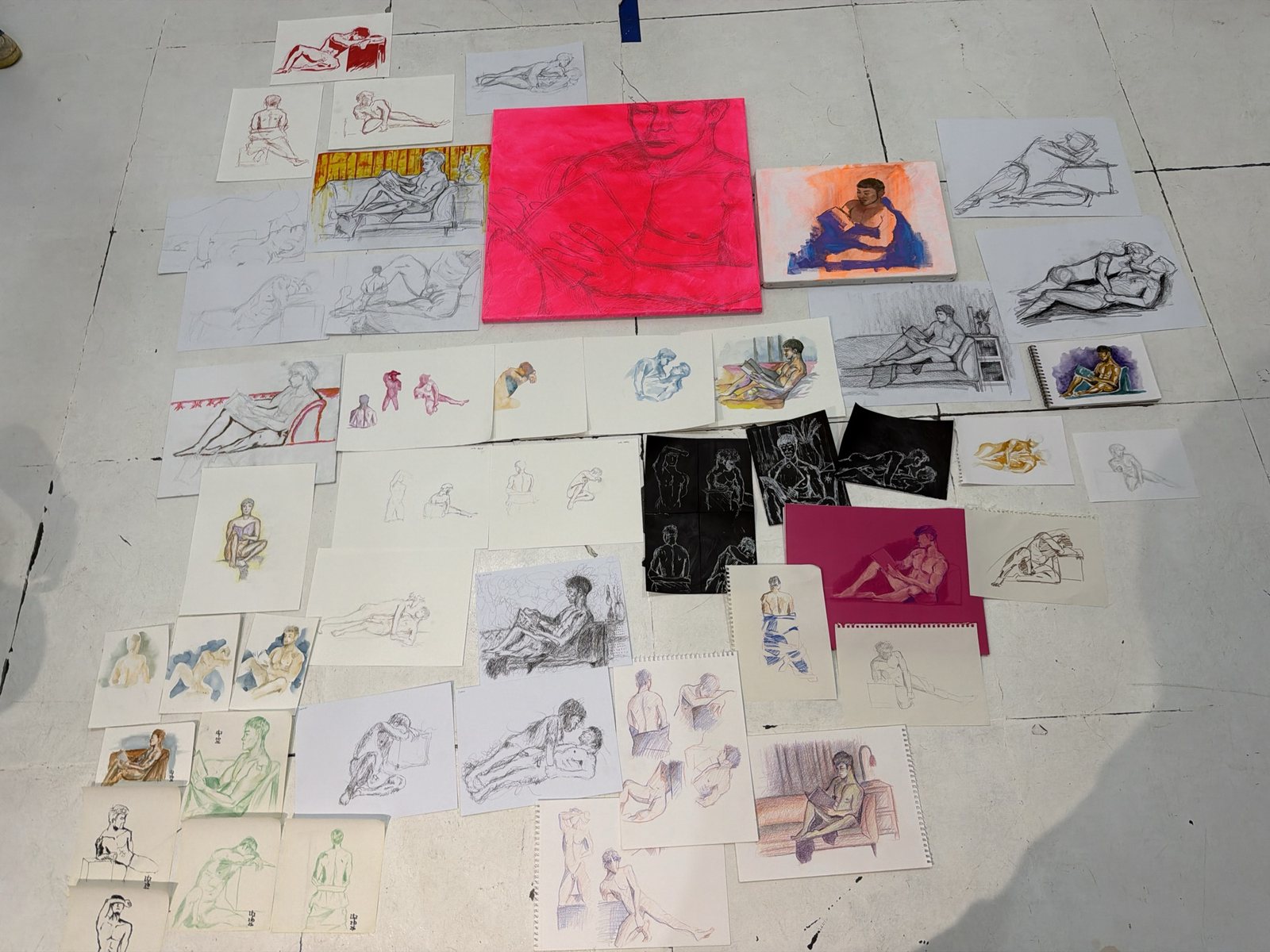 Every drawing from the night laid out on the floor